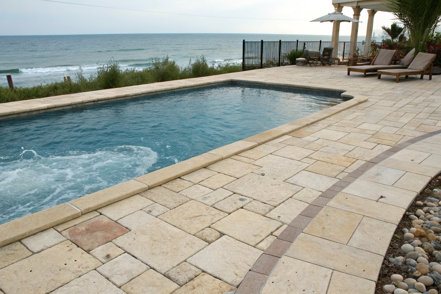 Textured non-slip sandstone pavers for safe pool area surfaces